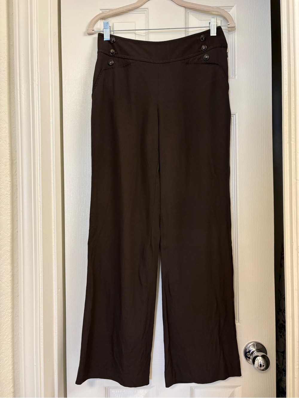 Vintage brown flare leg dress pants with button detail at hip